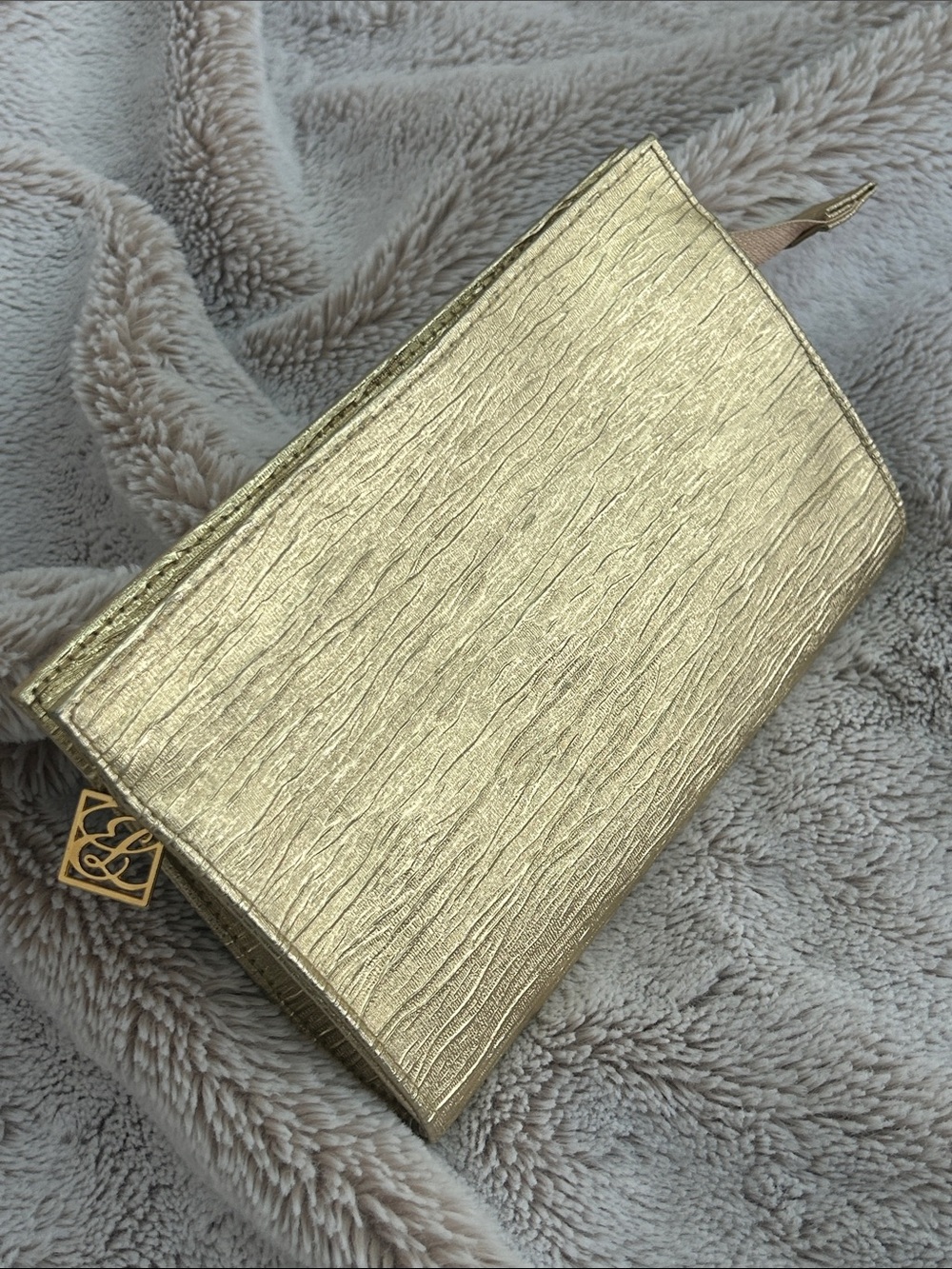 Estée Lauder gold colored cosmetic case